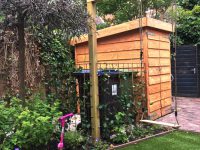Tuinaanleg, harmonicadoek op pergola Overveen