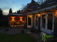 Sfeervolle tuinhuis met overkapping op maat gebouwd in Overveen